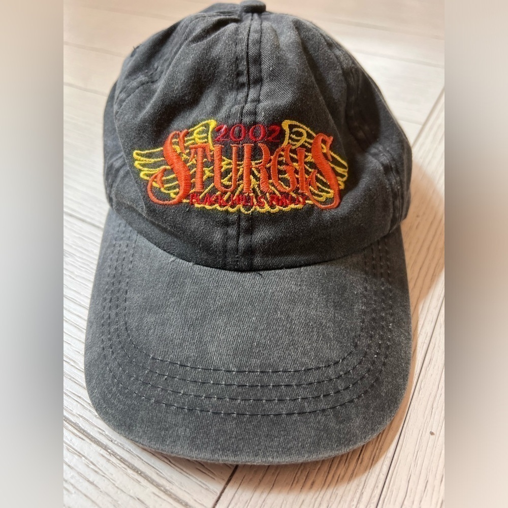 2002 Sturgis Black Hills Rally black baseball cap.‎ Adjustable. Adult sized.